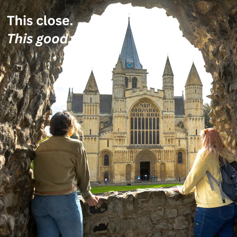 Two women looking out from Rochester Castle to Rochester Cathedral