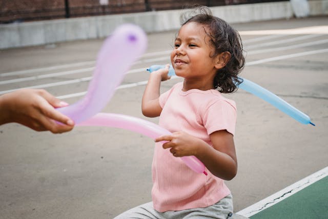 Child with balloon on a playground
