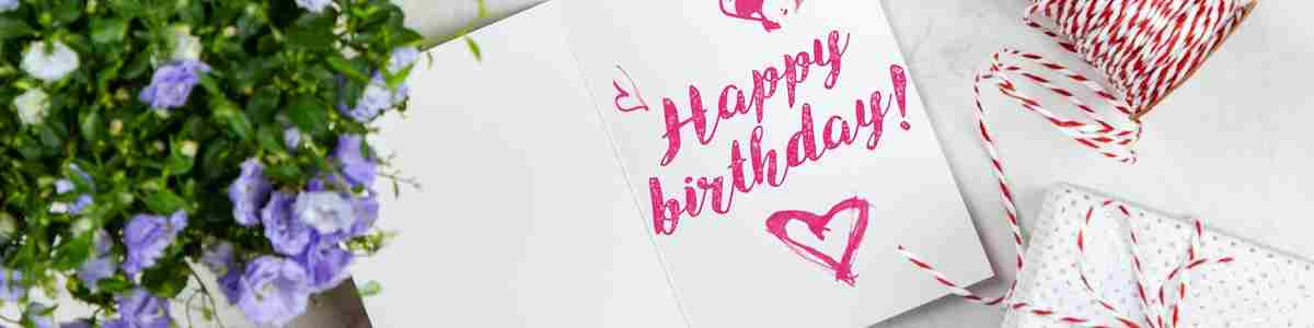 Happy Birthday Card Beside Flower Thread Box And Macaroons 2072181 (1)