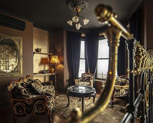 Albion Rooms Bedrooms By Jason Knott with dark ceiling, dark walls and sofa chair