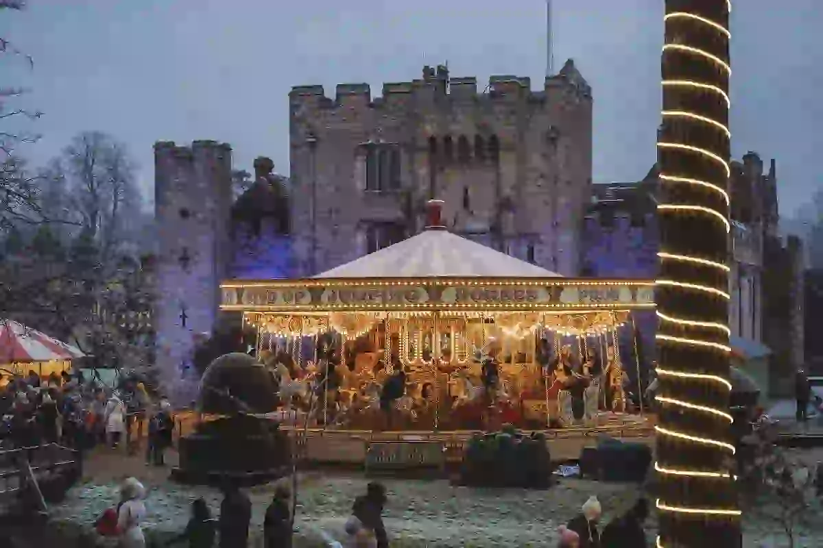 Hever Castle in winter with fair ground ride and lights